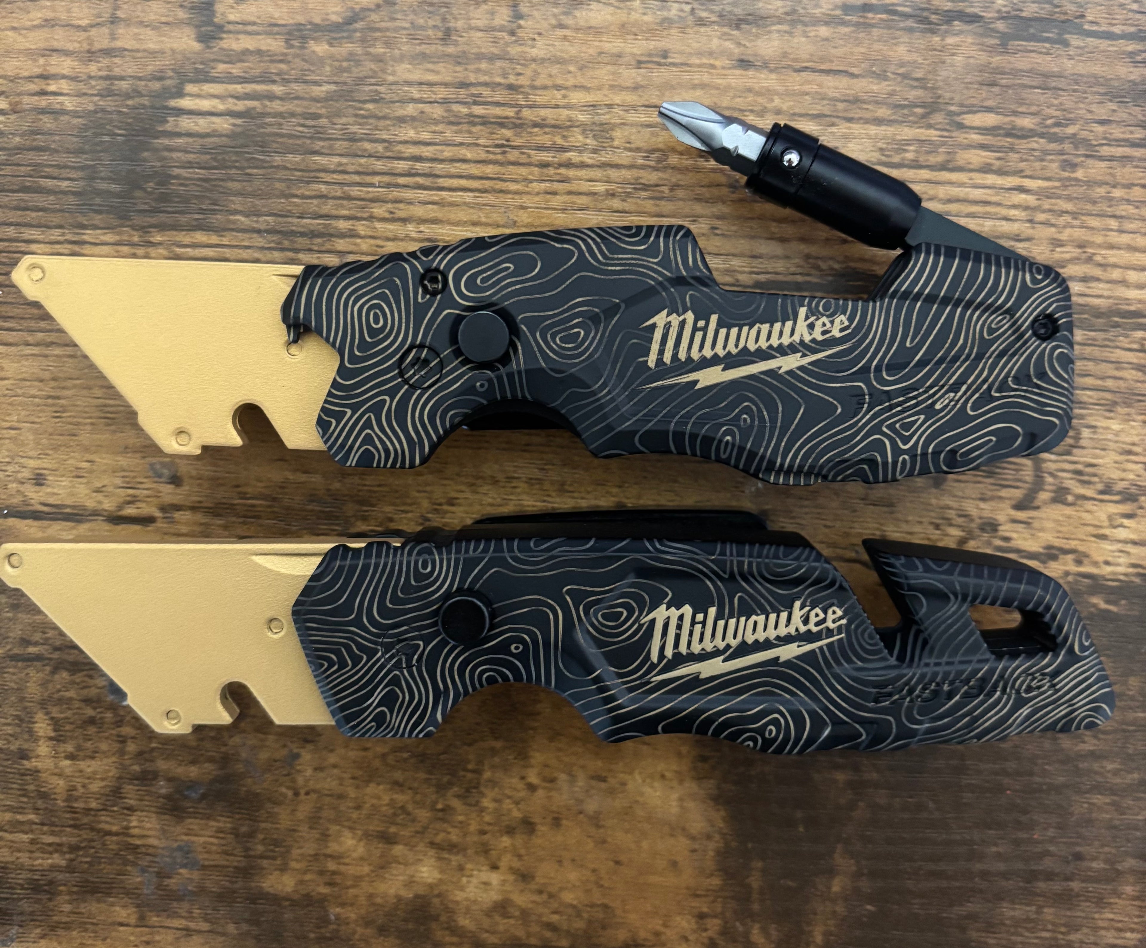 Milwaukee 6in1 Fastback Gold Black TOPO