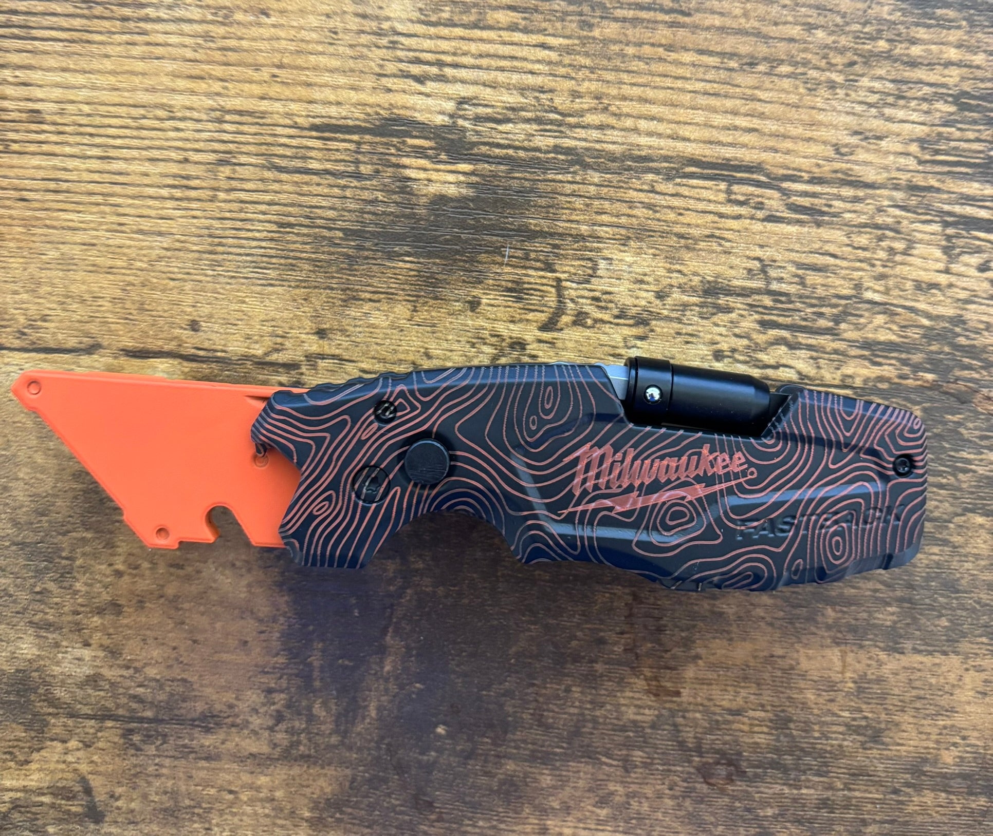 Milwaukee 6in1 Fastback Orange Black TOPO